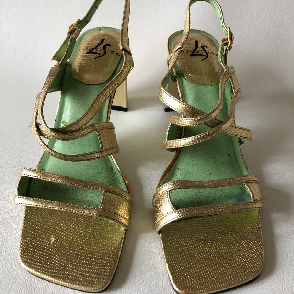 Make a bold statement in this metallic gold sandal!